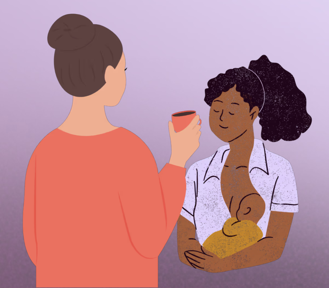 Two women sharing a quiet moment, one holding a cup of tea, the other breastfeeding her baby
